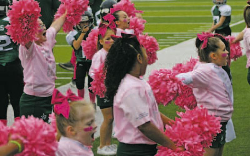 Breckenridge Little Bucks football players and cheerleaders will show their support of Breast Cancer Awareness Month by wearing pink socks, and pink uniforms for cheerleaders, during their games each Saturday during the month of October. Photos/ Stevie Watkins