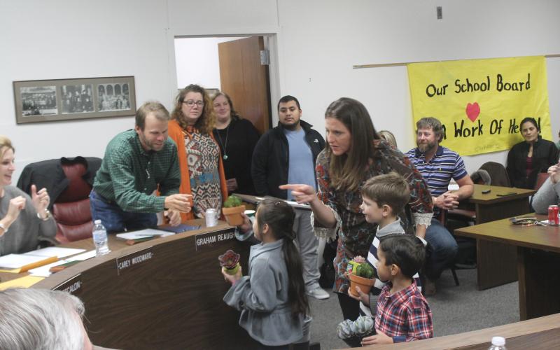 BISD students gave speeches they memorized to the board members and gave them each a potted plant for decoration for School Board Appreciation Month. BA photo by James Norman