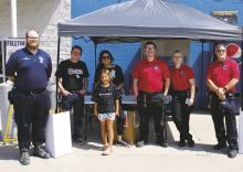 Members of Breckenridge Police Department, Stephens Memorial Hospital and Sacred Cross EMS took shifts Friday outside Walmart for the annual Pack the Bus school supply drive. Backpacks with supplies will be distributed at the Back-to-School Bash from 4 to 6p.m. today, Wednesday, Aug. 2, at 207 South Geneva St., along with free snow cones. Photos/Mike Williams