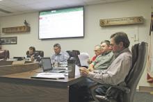 The Breckenridge ISD Board of Trustees listen to a presenta- tion from Vince Moore and Kelly Martin of the BISD technol- ogy department. The two expressed the importance of network upgrades. Photo/Mike Williams