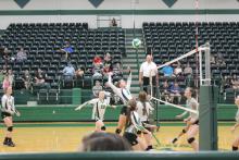 Anna Reaugh (5) has just gotten a set from Kinley Kanady (1) and goes up for a slam back at the Paradise defenders. Lady Bucks teammates McKinley Roberts (8), Grace Niklas (20) and Lilly Woodward (11) look on. The game was played at the Breckenridge ISD Athletic and Fine Arts Center, Tuesday, Sept. 18. BA photo by Jean Hayworth