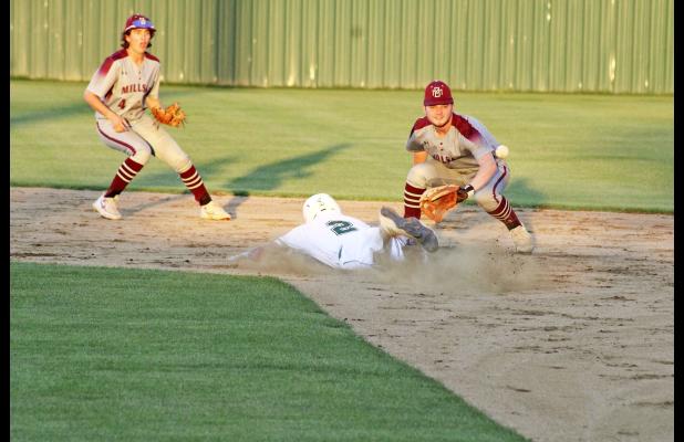 Cam Escalon slides and beats out a throw to steal second base during the third inning Tuesday, April 23 during the Bucks' 7-0 win over Millsap. Photo/Mike Williams