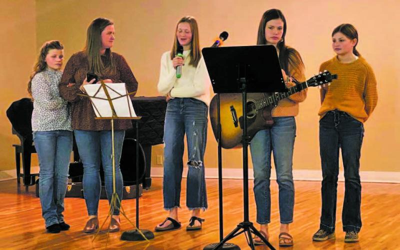 The Griffith family, left to right: Joyanna, Erin, Sara Kate, Emma (on guitar), and Hanna Grace, during the Breckenridge Woman’s Forum monthly meeting. Contributed photo