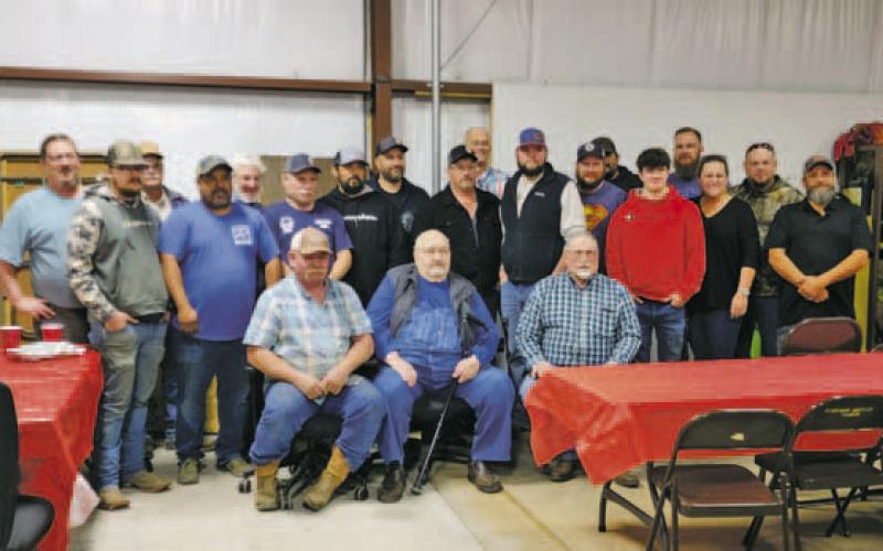 Members from Hubbard Creek Volunteer Fire Department joined Tom Claybrook, retiring fire chief, at an event. Claybrook retired Monday, Dec. 12. Contributed photo