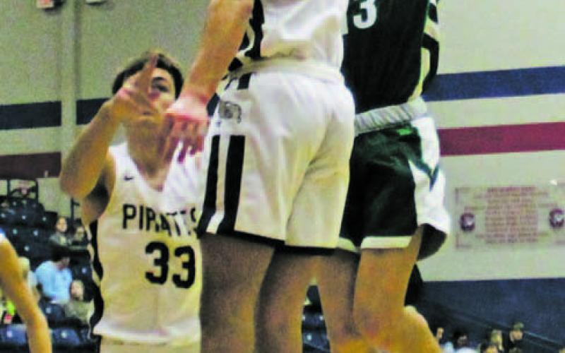 Karter Smalley shoots a jump shot over a Pirates defender during the second quarter of the Bucks’ 8258 loss Friday, Dec. 9 to Perrin-Whitt during the Red, White and Blue Tournament at Graham High School. Photos/Mike Williams