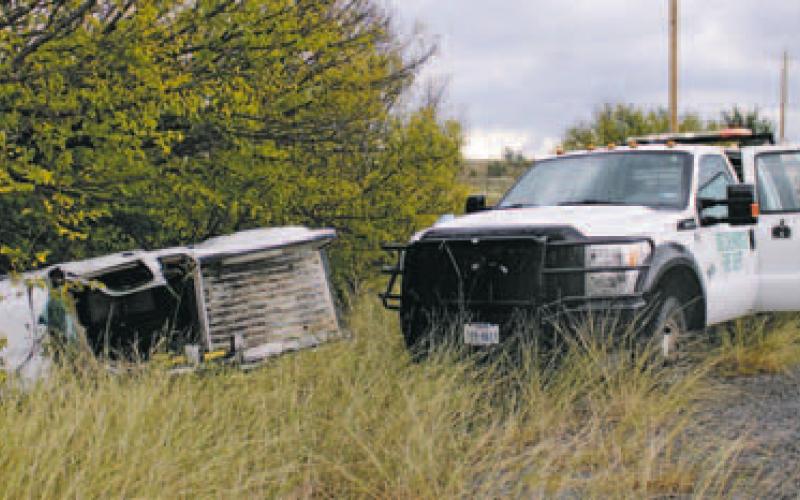 One man was transported to Abilene on Friday, Nov. 4 following a single vehicle rollover on Hwy. 183 North near Clear Fork. The white Ford Ranger was traveling southbound when the vehicle crossed the northbound lane and left the road. Firefighters from Breckenridge Fire Department used powered equipment to open the vehicle before EMS and law enforcement officers removed the man in order to provide aid. Photo/Stevie Watkins