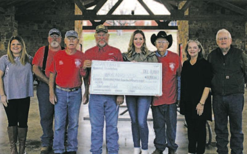 Members of the Everett family presented donation checks to representatives from Wayland, Caddo and Hubbard Creek Volunteer Fire Departments Thursday, Dec. 8 at the Breckenridge City Park. A total of $35,814 was raised for the 2022 Sloan Everett Pure Country Pedal, allowing the family to donate $11,938 to each of the three volunteer departments. Photos/Stevie Watkins