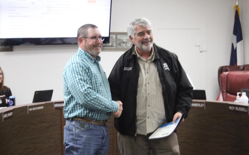Langford presents BISD Board with check for $1,500