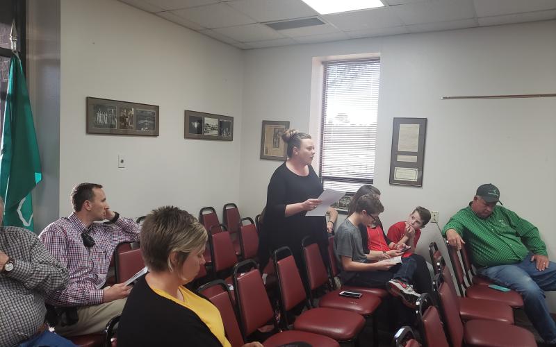 Amy Loftis gives comment to the board and details her concerns about bullying within the district. BA photo by James Norman