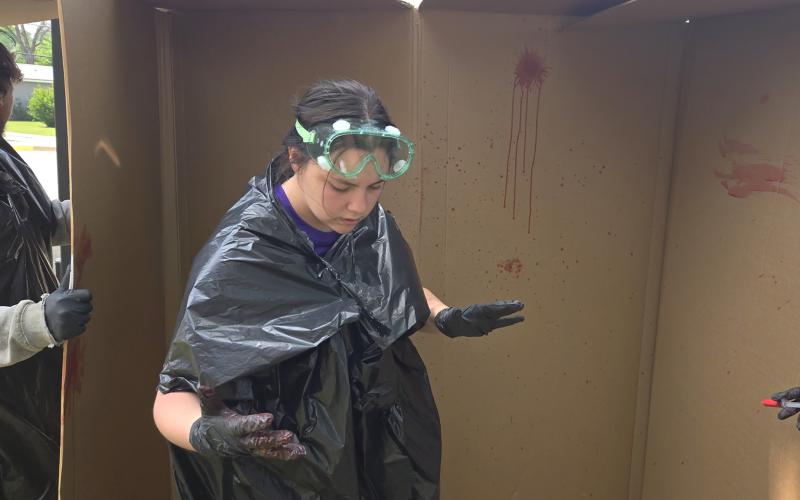 Students in the forensic science class at Breckenridge High School use different tools to make blood spatter patterns on cardboard. The students have been learning various aspects of crime scene investigations. (BISD Journalism/Contributed photo)