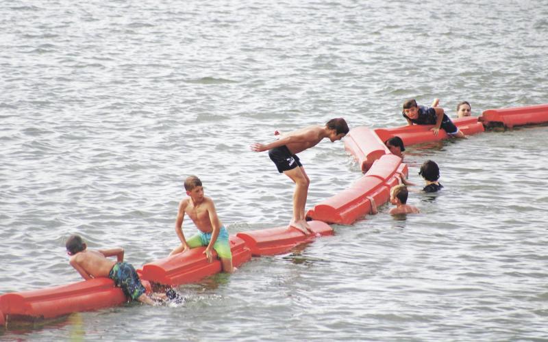 (Archive photo) Area children swim at Hubbard Creek Lake while awaiting the Boomfest firework show in July 2023. The event will be returning this year Saturday, July 4 due to local support.
