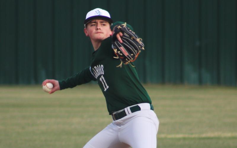 Preston Burns rears back to make a throw to first from the shortstop position during the Buckaroos’ opening scrimmage in February. Burns helped contribute to a home win Friday, March 27 against Dublin. (Archive photo)