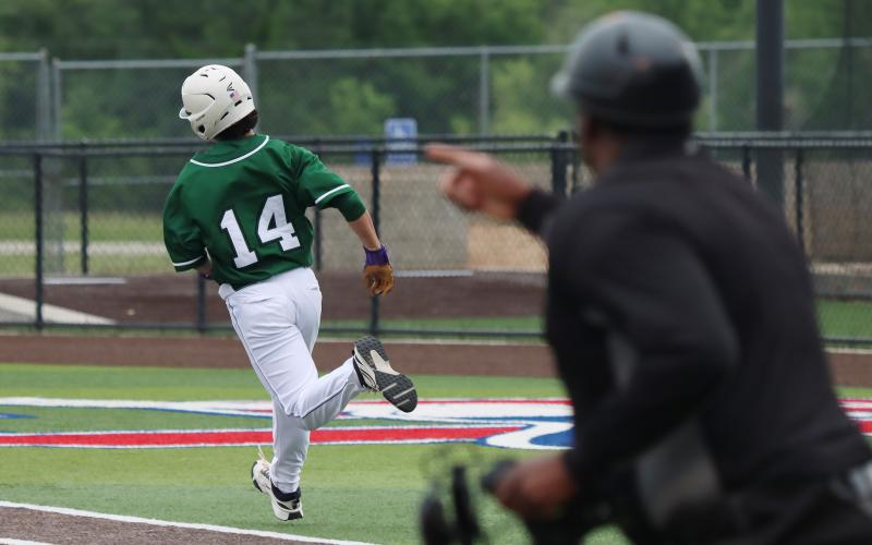 (Photo, Thomas Wallner) Marky Perez runs to first base after a hit during Game 2 against the Iowa Park Hawks held Thursday, April 30 at the Graham High School baseball field. The Bucks fell 8-0 in Game 2 and concluded their season at bi-district.