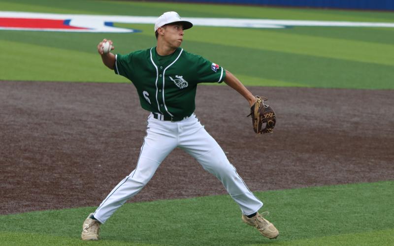 (Photo, Thomas Wallner) Cooper Wimberley prepares a throw after scooping up a hit from the Iowa Park Hawks during Game 2 held Thursday, April 30 of the best-of-three bi-district matchup. Games were held in Bowie and Graham.