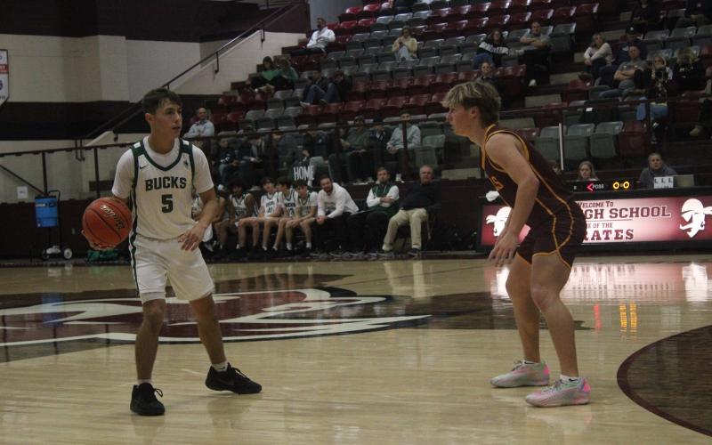 (Photo/Alex Kielar) Cooper Wimberley dribbles up court during the first half of the Bucks’ loss to Bells in their opening game of the Eula Tournament, before they went on to go 2-2 overall in the tournament. 