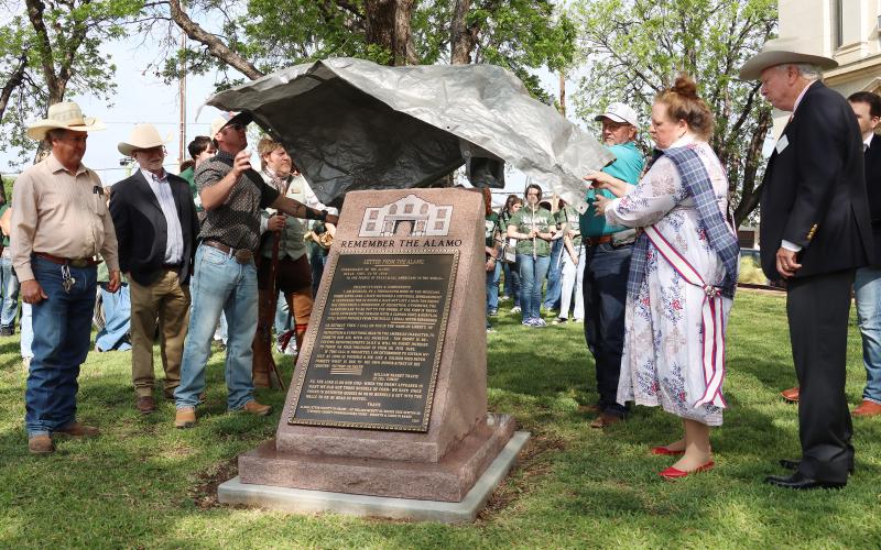 (Photo/Thomas Wallner) A plaque featuring the Col. William Barret Travis “Victory or Death” letter is unveiled during a ceremony held Tuesday, April 14 at the Stephens County Courthouse. The historic event also recognized 100 years of the Stephens County Courthouse.