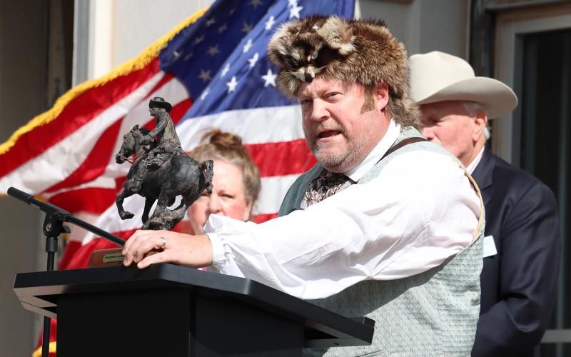 (Photo/Thomas Wallner) Errol Flannery, the fourth great grandson of David Crockett and president of the David Crockett Chapter of the Sons of the Republic of Texas, speaks at an unveiling ceremony for a plaque featuring the Col. William Barret Travis “Victory or Death” letter.