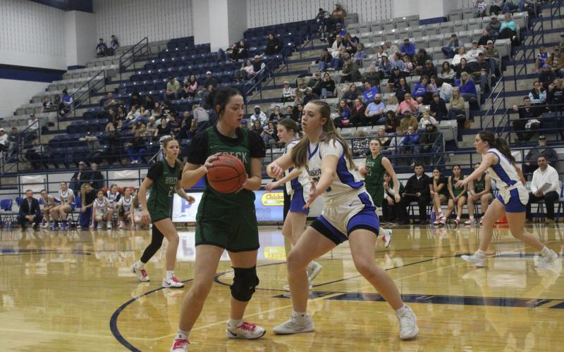 (Photo/Alex Kielar) Paisley Thibodeaux holds the ball during the Lady Bucks’ 49-21 loss Friday, Jan. 16 to the Peaster Lady Hounds. 