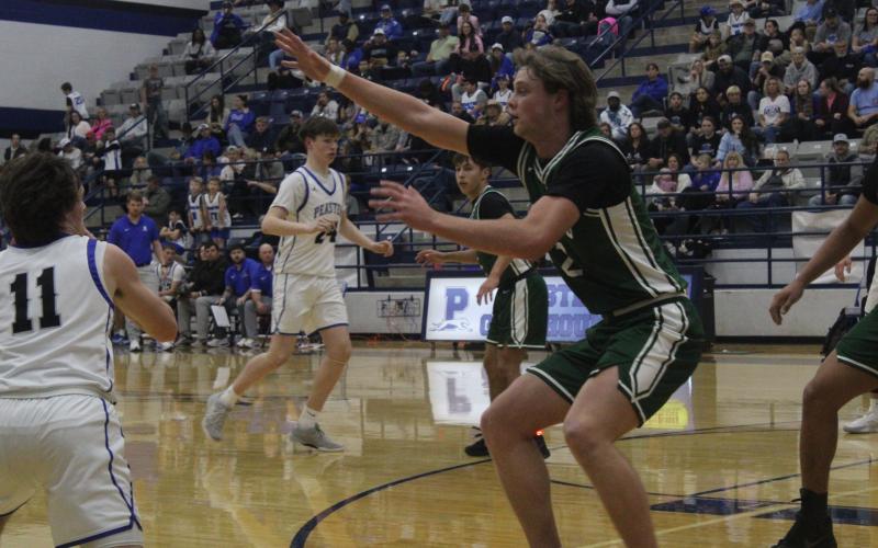 (Photo/Alex Kielar) Hudson Woodward defends against a Peaster Greyhounds player in the first half of the Buckaroos first district loss Friday, Jan. 16.