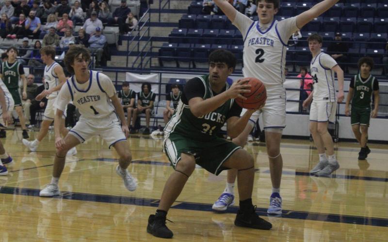 (Photo/Alex Kielar) Joacim Fernandez posts up in the paint during the second half of the Buckaroos game against Peaster in which they were handed their first district loss Friday, Jan. 16. 
