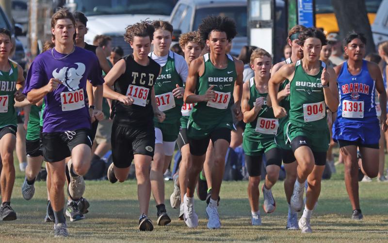 (Photo/Liam Bailey) Andrew White, middle, runs during the Brownwood Invitational Wednesday, Aug. 27 in which he placed ninth overall as the best finisher for the Bucks. 