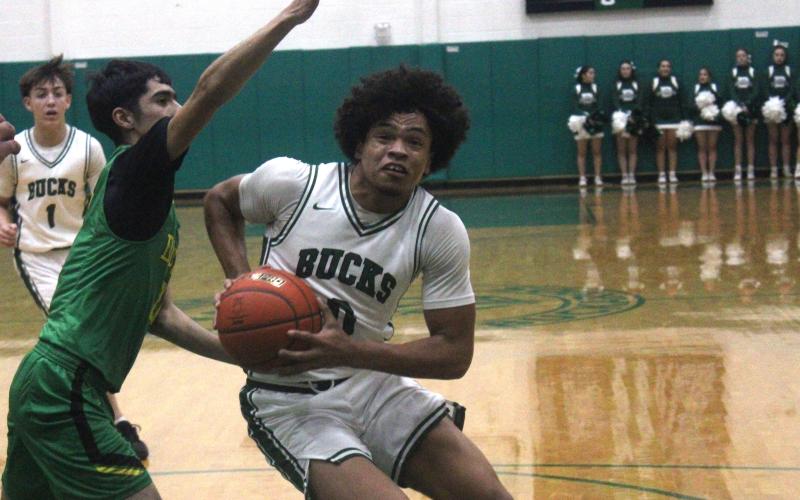 (Photo/Alex Kielar) Douglas White drives to the basket during the first half of the Bucks’ close loss to the Dublin Lions as they fell just short Tuesday, Feb. 3. 