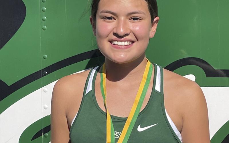 Melody Stewart earned a medal for her seventh-place finish in the girls junior varsity race at the Dublin FCA cross country meet Wednesday, Sept. 20 at Dublin High School. Photo/Donny Funderburg