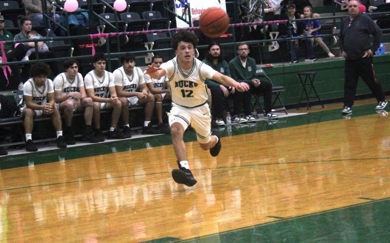 (Photo/Alex Kielar) Ryan Waller goes after a loose ball that is just out of his reach, summing up the Bucks’ being just out of reach of coming out with a victory Tuesday, Feb. 3 in thrilling district game at home against Dublin. 