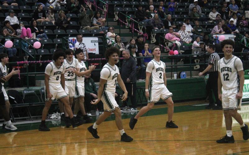 (Photo/Alex Kielar) The Buckaroos celebrate after Christian Flores drilled a tying three-pointer in the closing minutes of a hard fought 65-61 loss to the Dublin Lions. 