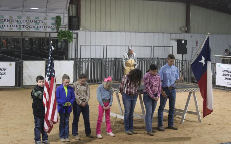 (File Photo) Last year’s Stephens County Junior Livestock Show begins with the National Anthem and a prayer. The 68th annual Stephens County Junior Livestock Show and Sale will take place next week at the Stephens County Ag Center, from Thursday, Jan. 8 through Sunday, Jan. 11. 