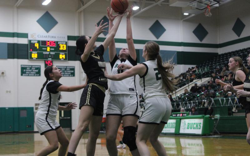 (Photo/Alex Kielar) Paisley Thibodeux, middle, and Preslie Malcuit, right, fight for a rebound against a Gordon player during the Lady Bucks’ 58-23 loss to the Lady Longhorns, Tuesday, Nov. 12. 