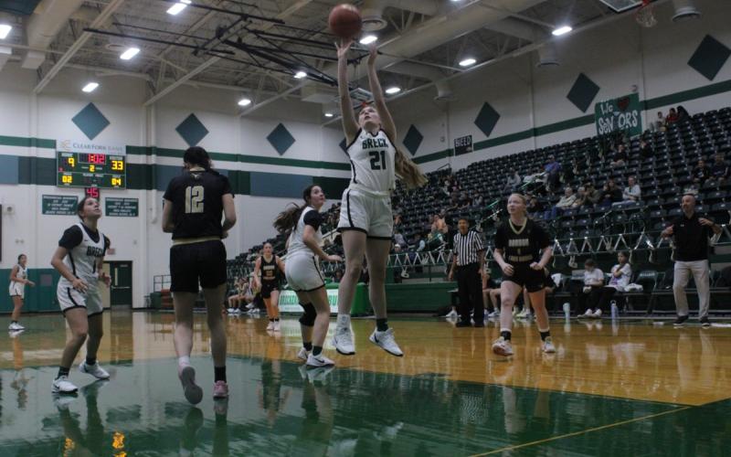 (Photo/Alex Kielar) Preslie Malcuit shoots at the basket in the paint during the Lady Bucks’ non-district home opening game Tuesday, Nov. 11 against the Gordon Lady Longhorns. Malcuit led the team with eight points on the night. 
