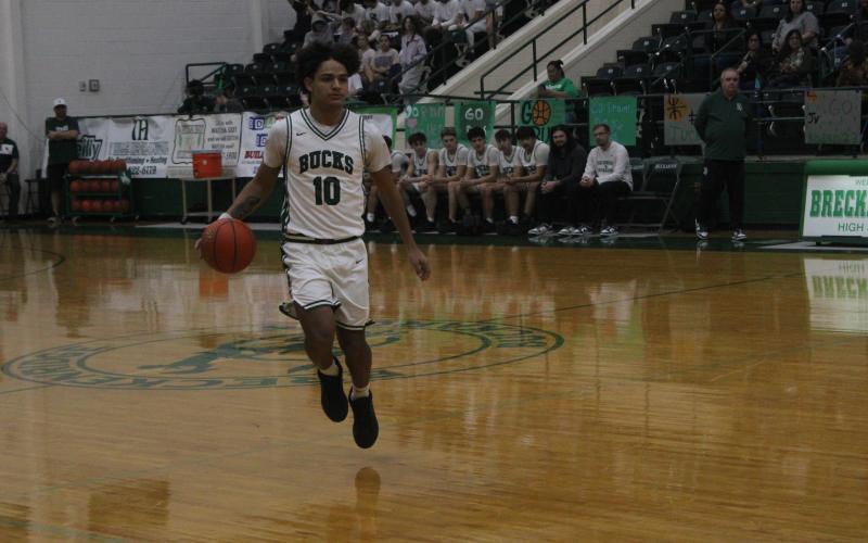 (Photo/Alex Kielar) Jaime Cruz dribbles the ball in the opening minutes of the Bucks’ 63-42 win against Comanche, in which he was the second-best scorer for the home team on Senior Night, scoring 16 points. 