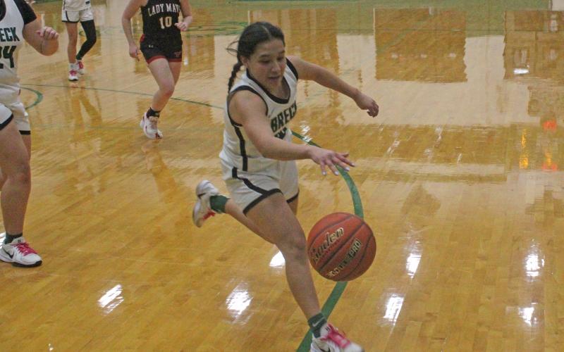 Victoria Martinez fights to save the ball from going out of bounds in the second half of the Lady Bucks’ 34-27 loss to the Eastland Lady Mavericks on Thursday, Jan. 29.  (Archive photo)
