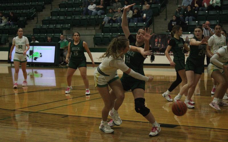 (Photo/Alex Kielar) Paisley Thibodeaux, who scored 10 points in the 46-34 road win, defends an attempted pass into the paint during the first half of the team’s first district win of the season. 