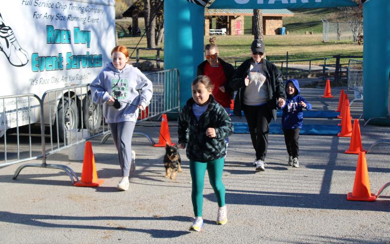 (File Photo) Runners (and dogs) race in the 9th Annual Wags & Whiskers 5k in 2023 which benefits the Stephens County Humane Society every December. 