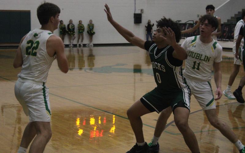 (Photo/Alex Kielar) Douglas White defends against a Dublin Lions player in the corner during the first half of the Bucks’ road district 58-37 win Friday, Jan. 9. 