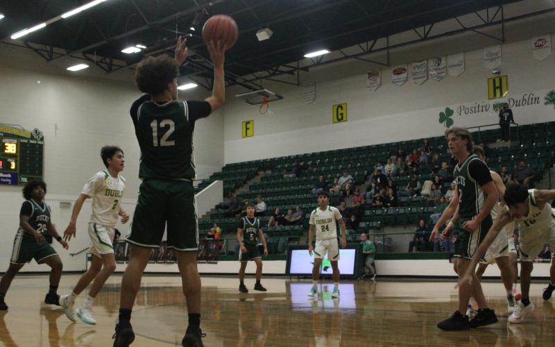 (Photo/Alex Kielar) Ryan Waller attempts a corner three Friday, Jan. 9 during the second half of the Bucks’ road district win over Dublin, 58-37. Waller led the team with 14 points in the game. 