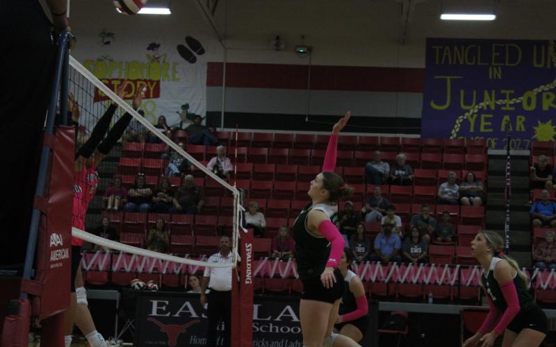 (Photo/Alex Kielar) Preslie Malcuit hits the ball over the net as the Eastland player looks to block the hit Friday, Oct. 10. 