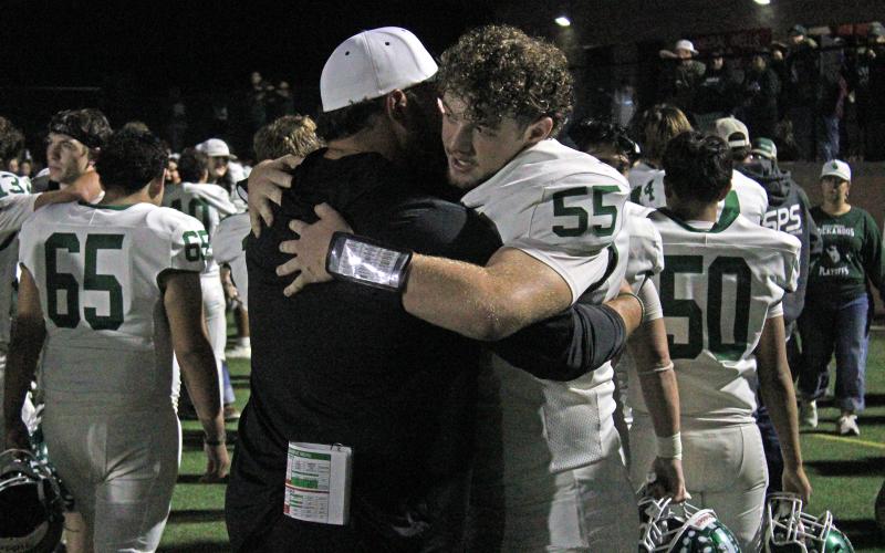 (Photo/Alex Kielar) Senior offensive lineman Brandon Niblett hugs Buckaroos’ offensive coordinator Jarrod Shepperd following the team’s loss to the Paradise Panthers in the bi-district round. Niblett earned a selection to the first team offense in the all-district awards announced this week. 