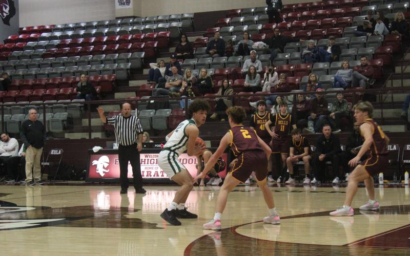 (Photo/Alex Kielar) Ryan Waller holds the ball against a Bells defender Monday, Dec. 29 in the first half of the Bucks’ first game in the Eula Holiday Classic. The Bucks went 2-2 overall in the tournament. 