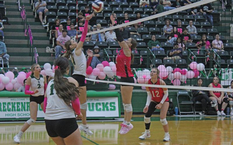 (Photo/Alex Kielar) LaKyla Bartley hits the ball over the net over the block attempt of a Lady Lions player Friday, Oct. 17 during a Senior Night win for the Lady Bucks. 
