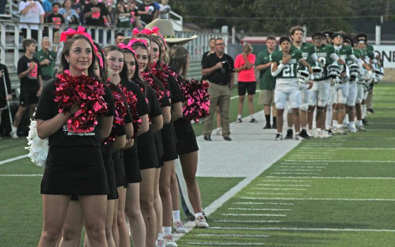 (Photo/Alex Kielar) Breckenridge cheerleaders were all “pinked out” for the Buckaroos’ game against Jim Ned as they stood for the national anthem before the game Friday, Oct. 17. 