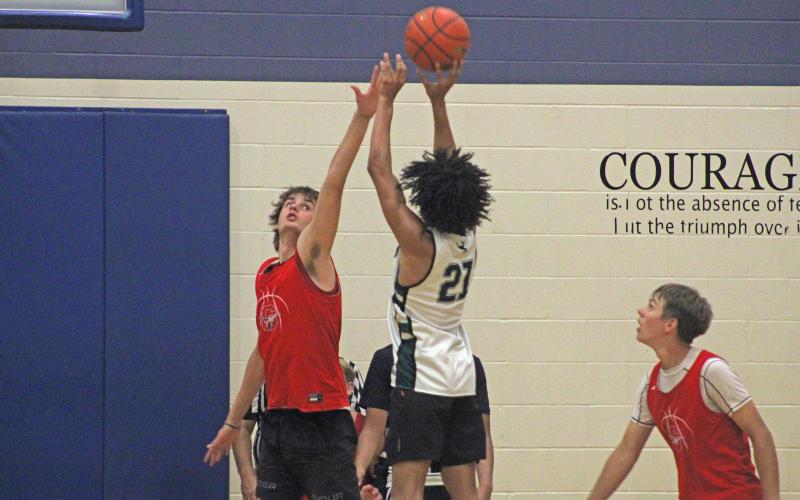 (Alex Harvadansky/Graham Leader) Andrew White shoots over a Graham defender during the third week of the Steers’ fall basketball league Monday, Oct. 6. 