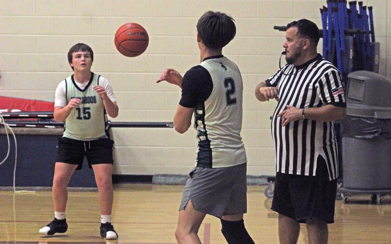 (Alex Harvadansky/Graham Leader) Connor Salazar inbounds a pass to Kaden Shook during the Bucks' third week of competing in the Graham fall basketball league. 