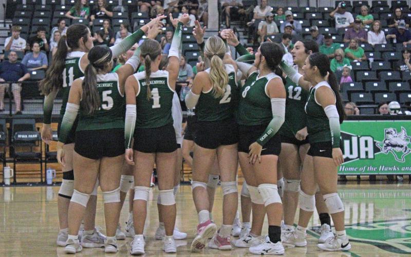 (Photo/Alex Kielar) The Lady Bucks huddle up as they get set to face off against the Iowa Park Lady Hawks in a non-district matchup on the road Tuesday, Aug. 19. The Lady Bucks lost two sets to zero, but showed promise. 