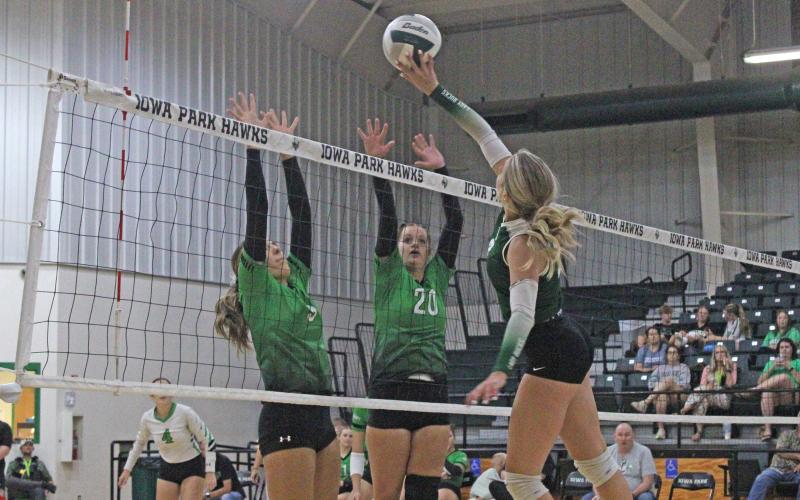 (Photo/Alex Kielar) Lady Bucks’ Lane Bartoskewitz attempts a tip over the net over two Lady Hawks’ defenders attempting to block on the other side during the non-district matchup at Iowa Park that took place Tuesday, Aug. 19. 