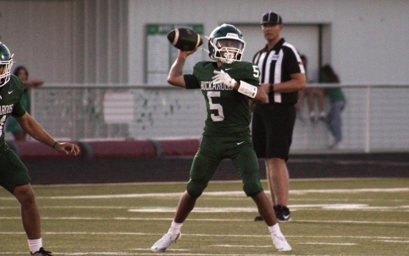 (Photo/Alex Kielar) Cooper Wimberly looks to pass to his left during the Bucks’ scrimmage against Wall in which the three-quarterback competition continued for another week, Thursday, Aug. 21. 