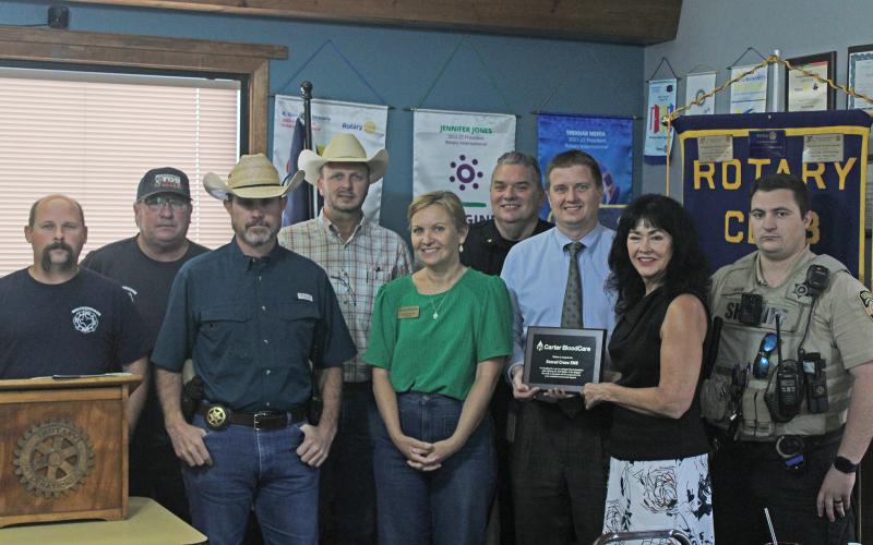 (Photo/Alex Kielar) Local first responders gather around with the winning plaque for the 2025 Battle of the Badges, which winner Sacred Cross EMS was not in attendance to accept. From left to right is BFD Assistant Chief Wes Turner, BFD Chief Malcolm Bufkin, Chief Sheriff’s Deputy Justin Rose, Sheriff Kevin Roach, Carter BloodCare’s Colleen Horan, BPD Chief Blake Johnson, Carter BloodCare’s Clinton McCoy, Rotary Club of Breckenridge President Cynthia Northrop and Sheriff’s Office Kyler Miller. 