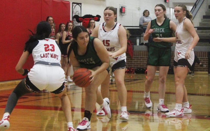 (Photo/Alex Kielar) Kyra Canada looks to pass out of the paint against the Eastland Lady Mavericks defense Friday, Dec. 19 in the final game for the Lady Bucks before the Christmas break. 